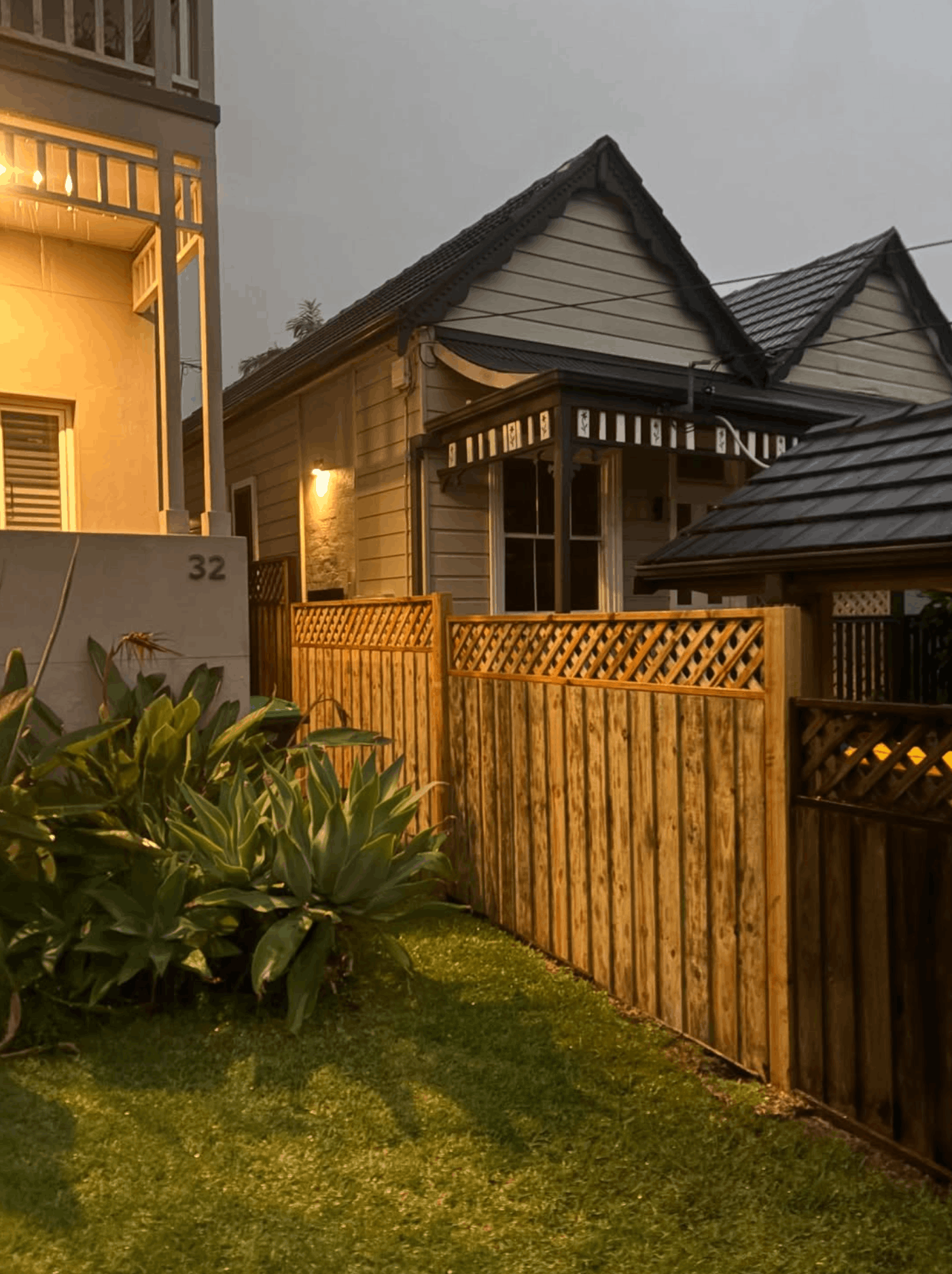 Custom timber paling fence with lattice top